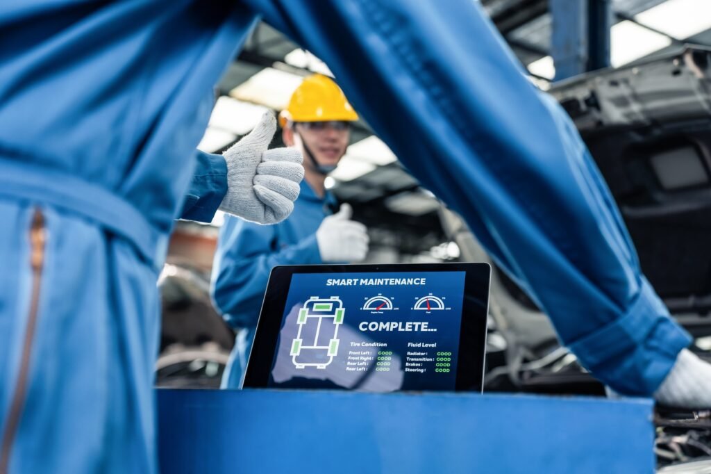 Close up of Automotive mechanic running diagnostics software on tablet.